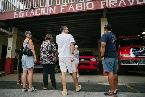 The walking tour group outside the Fabio Bravo fire station in Bocas Town