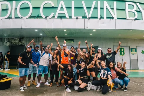 A large group cheering outside Calvin Byron Stadium